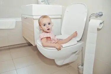 Baby sitting on the toilet