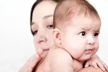 Patting on back so infant can burp