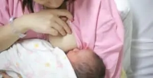 A mom breastfeed her baby