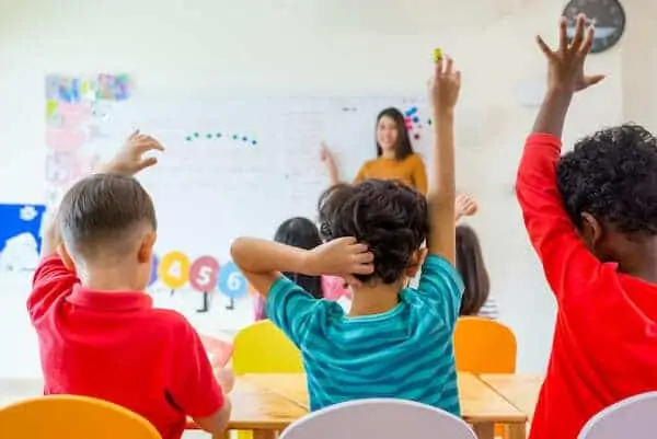 See the kids are learning on whiteboard in classroom