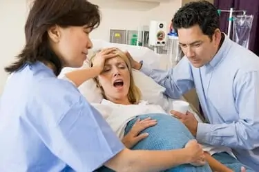 Woman in labor pain in hospital