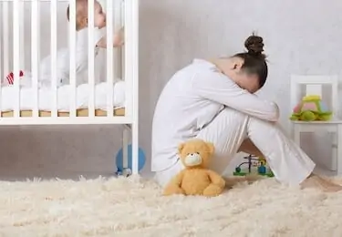 Young mother between 30 and 40 years old is experiencing postnatal depression