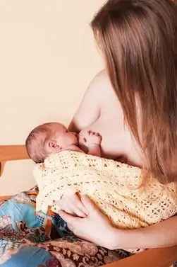 Mom breastfeeding newborn