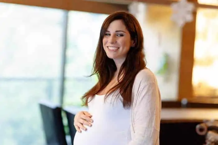 Cheerful smiling pregnant woman