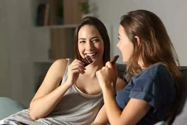 Two girls are enjoying chocolate!