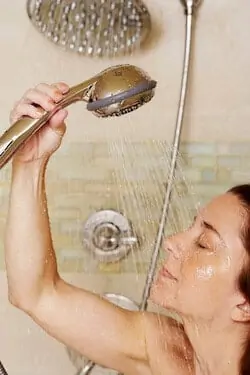 taking shower with hand shower