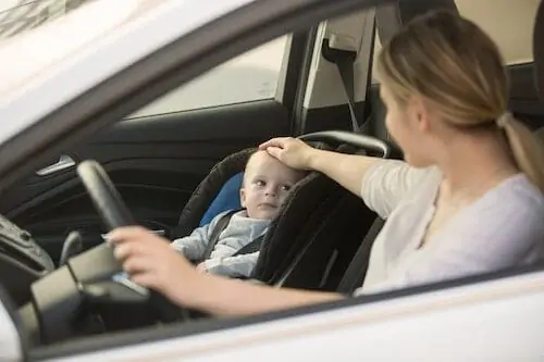 Mom with her boy driving alone