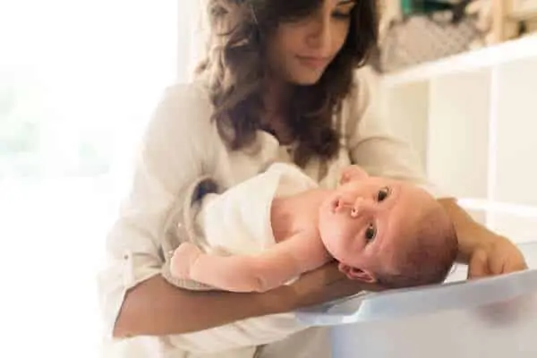 Newborn baby in a bath tub