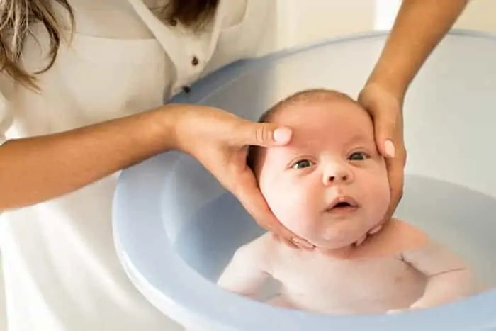 Newborn having a bath