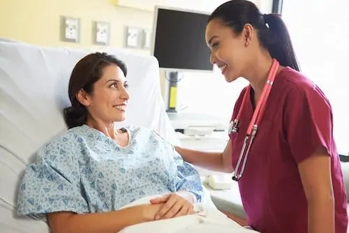 nurse with mom after c-section