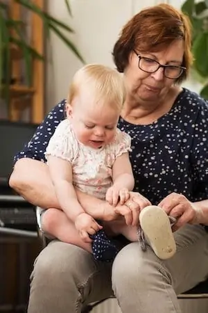 grandma helps toddler