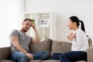 couple on sofa in argument