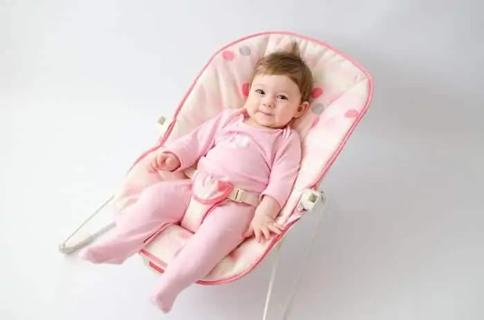 smiling baby on bouncer