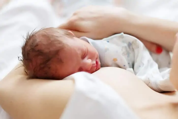 newborn baby with his mother