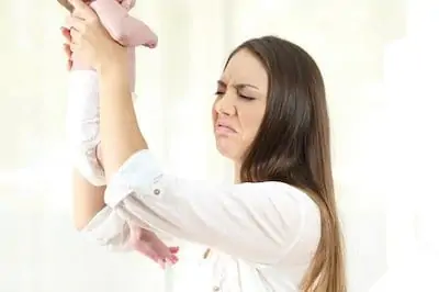 mom checking wet diaper