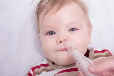 Baby using nasal aspiration