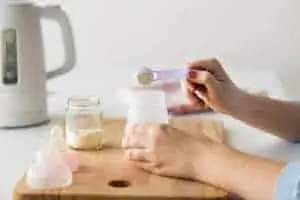 Mom preparing formula milk