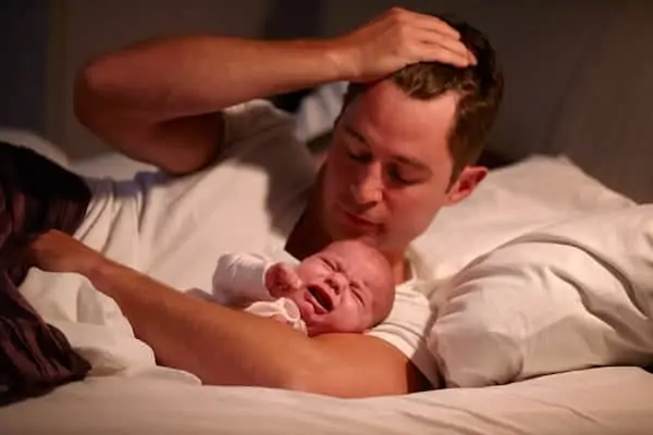 crying baby with dad
