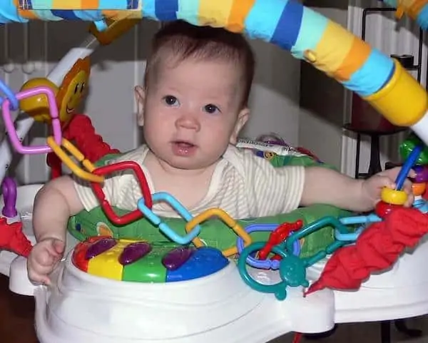 baby playing in a bouncer