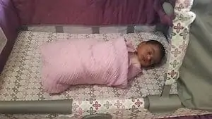 safe swaddle in a crib