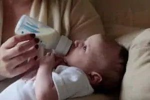 Cute baby bottle feeds