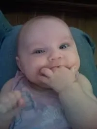 baby eating her fingers