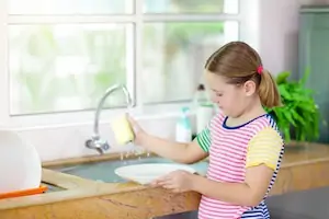 child helping mom on household chores