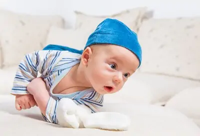 Baby boy playing with bunny