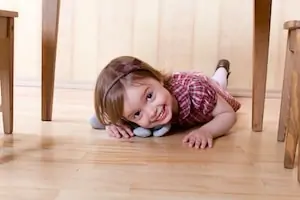 autistic girl crawling