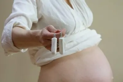 pregnant woman with tampons