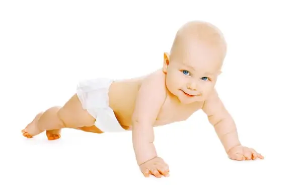 Cute baby crawls in diapers