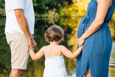 pregnant mom with toddler in a park