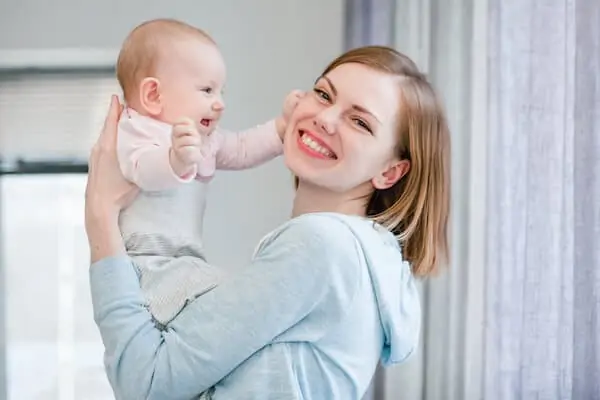 Young mother has fun with baby