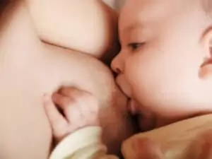 mom with big breast and nipple breastfeeds