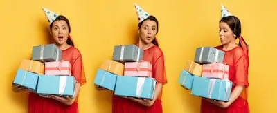 Pregnant woman in party cap holding stack of gifts