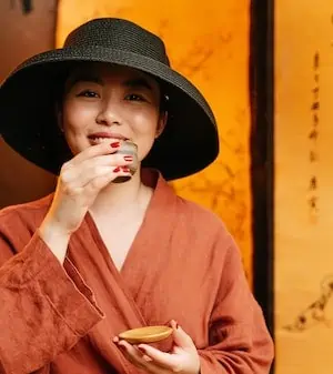 smiling woman holding a teacup