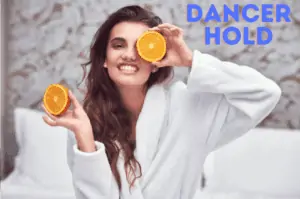 Woman with oranges in both hands