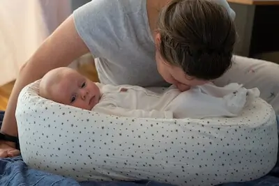 mother checking out newborn's diaper
