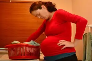 pregnant woman doing household chores