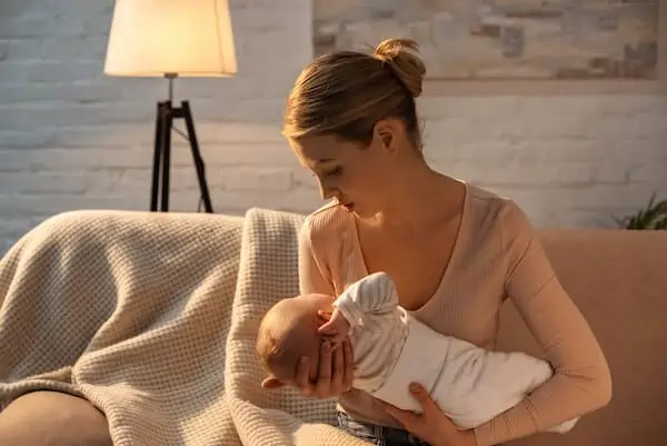 young mom holding her newborn
