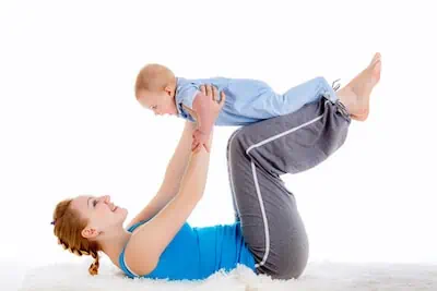 mom with infant doing exercise 