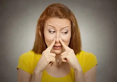 woman disgusted by bad smell