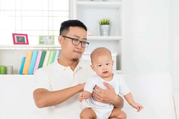 baby on father's lap