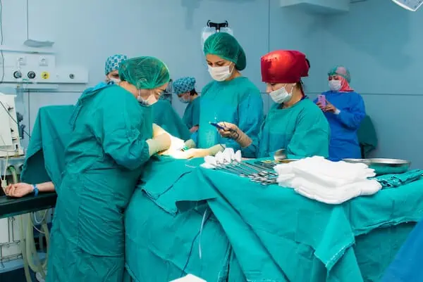 a team of surgeons doing cesarean surgery