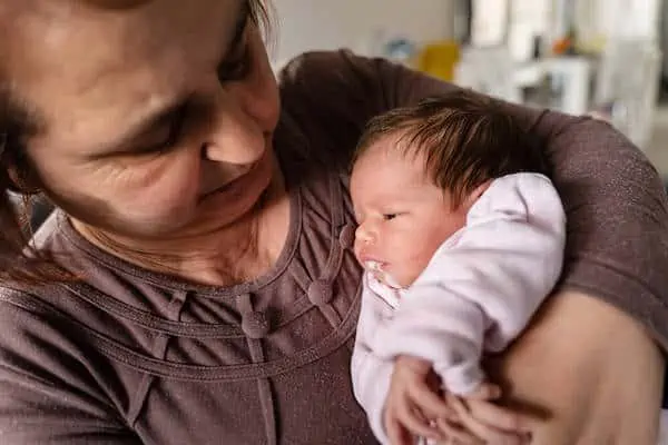 grand mom holds grandchild