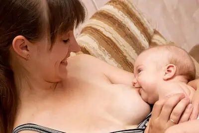 mom and baby looking eye to eye and smiling
