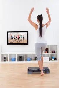 Athletic woman doing home exercises