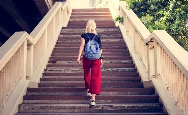 Woman Traveler Walking Stairs