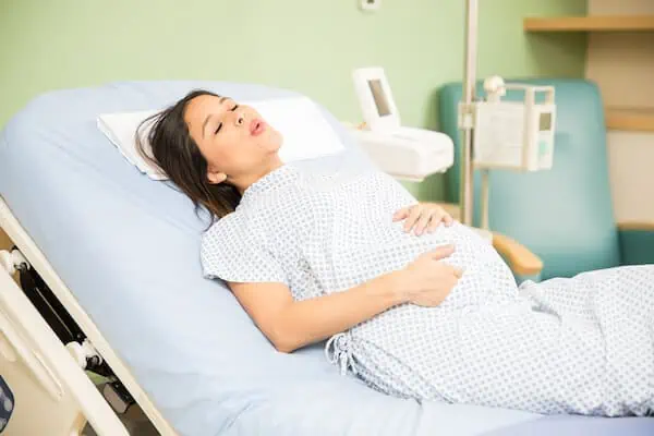 difficult in breathing during labor on a hospital bed
